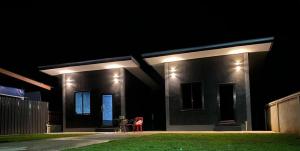 a house with lights on the side of it at night at View Doi Resort in Ban Mai Thung Mot