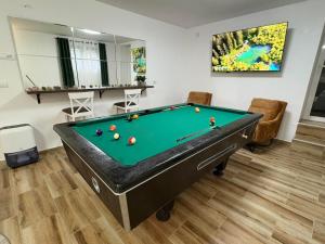 a billiard room with a pool table at Vila Pogled in Novi Sad