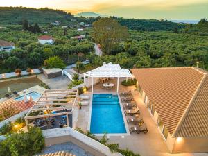 an aerial view of a resort with a swimming pool at Spartakos Villa Resort - Slow Living Retreat collections With Private Pools in Planos