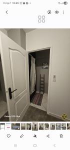 a room with a closet with a door open at Sophie Appartement in Villeneuve-sur-Lot