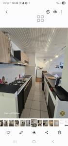 a view of a kitchen with a stove top oven at Sophie Appartement in Villeneuve-sur-Lot