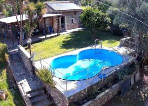 a swimming pool in the yard of a house at Oasi a Sant'Ilario in Genoa