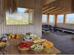a table with fruits and vegetables in a room at Casa Luna in Maitencillo