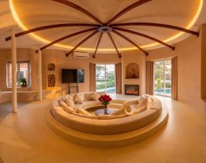 a large living room with a large circular couch at QUEEN VILLA - Hoa Tiên paradise in Ðông Hội