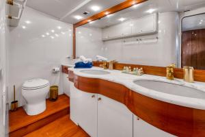 a bathroom with two sinks and a toilet in it at Yacht FALCON FIVE in Cannes +29 photos