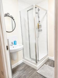 a bathroom with a shower and a sink at Private Ensuite room in Wolverhampton city centre in Wolverhampton