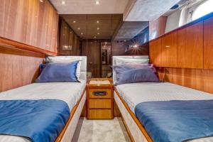 two beds in a small room in a boat at Yacht FALCON FIVE in Cannes