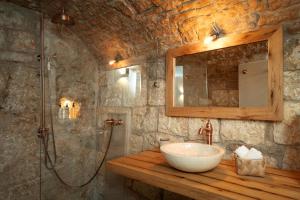 a bathroom with a sink and a shower at Villa Dida Hvar in Hvar +77 photos