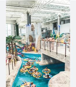 a group of people in the water at a water park at Apartament AquaTower, Aquapark Reda in Reda