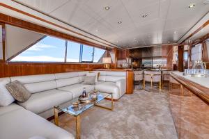 a living room with a couch and a table at Yacht FALCON FIVE in Cannes