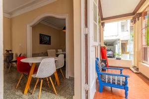 a dining room with a table and chairs at Maroca RIO in Rio de Janeiro
