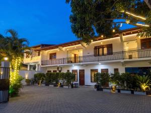 an exterior view of a building at night at minidu resort in Ambalantota