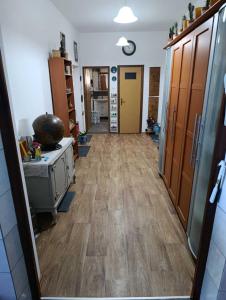 a hallway of a kitchen with a wooden floor at Rooms-Sema in Mostar