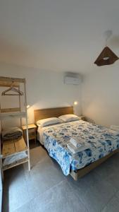 a bedroom with a bed and a ladder in it at Sea and Airport View in Fiumicino
