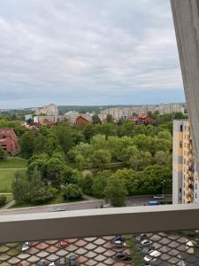a view of a city from the balcony of a building at COSMO Premium Park Chorzów, Parking, f-VAT klimatyzacja in Chorzów