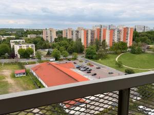 a view of a city with a parking lot and buildings at COSMO Premium Park Chorzów, Parking, f-VAT klimatyzacja in Chorzów
