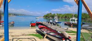a group of boats are docked at a dock at By The Bay 2plus2 in Oracabessa