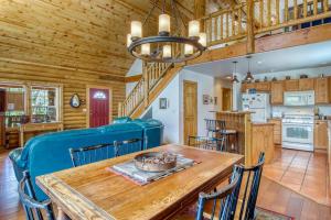 a dining room and kitchen with a wooden table and chairs at Heaven's Gate in Durango
