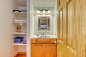 a bathroom with a sink and a wooden door at Heaven's Gate in Durango +60 photos