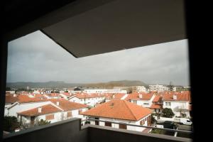 a view of a city with houses and roofs at Alba Esposende - Balcony Apartment in Esposende