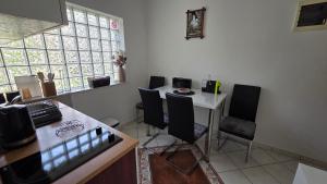 a kitchen with a table and chairs in a room at Apartment Tara in Igalo