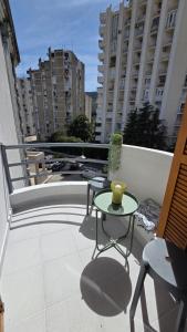 a patio with a table and chairs on a balcony at Apartment Tara in Igalo