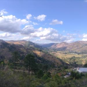 a view of a valley in the mountains at the Moonflower in Mbabane