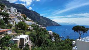 a view of the amalfi coast with houses at Domus Floris in Positano