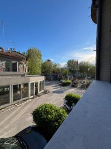 a balcony of a building with a parking lot at Residence Fortuna - Appartamento Gori in Fano