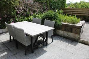 a table and chairs sitting on a patio at Ty Clyd in Pembrokeshire