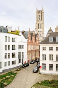 arial view of a city with buildings and a clock tower at Luxury B&B The Belgian Girl in Ghent