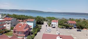 a town with a view of a river and houses at Ayışık Otel in Hamidiye