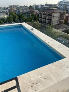 a large blue swimming pool on top of a building at Onix Home Love 203 in Mamaia Sat/Năvodari