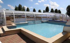a large swimming pool in a building at Le Cocon d'Ambon in Ambon