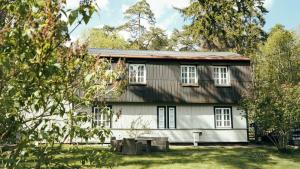 a white house with a gambrel roof at B5 Jurmala Apartments in Jūrmala