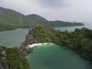 an island in the middle of a body of water at Sơn Tùng House in Quang Ninh
