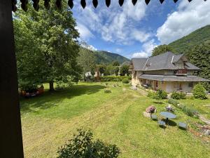 an aerial view of a house with a yard at La dépendance in Luchon