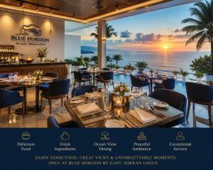 a restaurant with tables and a view of the ocean at Blue Horizon By Capt Logus in Ja-Ela