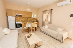 a living room with a couch and a table at K&J House in Didyma