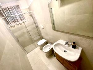 a bathroom with a toilet and a sink and a shower at Ca' Gregolina in Venice +12 photos