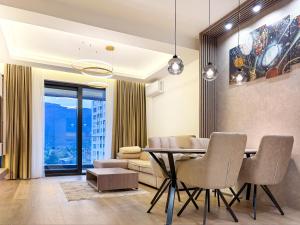 a dining room with a table and chairs at SKY Apartment in Sarajevo