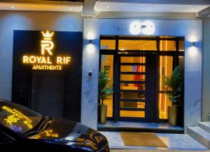 a royal rre restaurant with a car in front of it at Royal Rif Alhoceima in Al Hoceïma