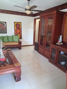 a living room with a couch and a table at Villa Lya in Juan Dolio