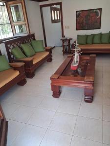 a living room with couches and a coffee table at Villa Lya in Juan Dolio