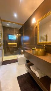 a bathroom with a sink and a mirror at Chalés e suítes vila verde in São Bento do Sul