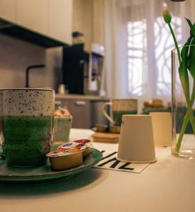 a table with a cup and a plate of food at B&B in centro in Eboli