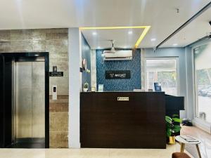 an office with a lobby with a reception desk at Melvet Residency in Cochin
