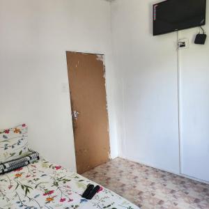 a room with a door in the corner of a room at S-and Kasa Guest House in Pietermaritzburg