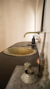 a sink in a bathroom with a counter top at Casa Atlantida - Sea front in Faja Grande +47 photos