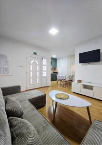 a living room with a couch and a table at Apartmani Marija - Vila Marija in Šilo +52 photos
